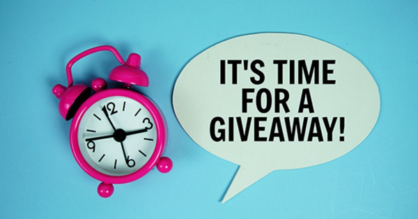 Pink alarm clock and text saying it’s giveaway time.