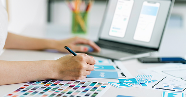 Creative ux designer designing mobile friendly Veterinary website