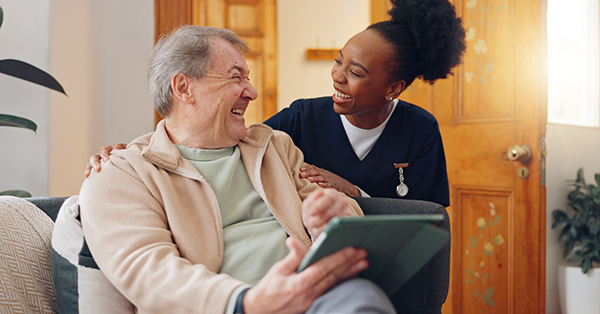 nurse talking to elderly patient