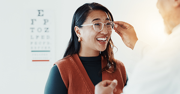 woman with glasses and a eye doctor