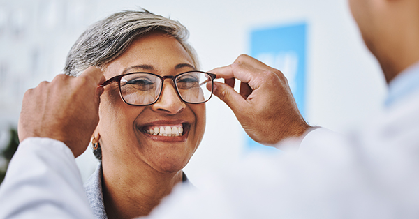 Woman trying out glasses at a clinic