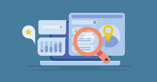 Magnifying glass on laptop with location marker.