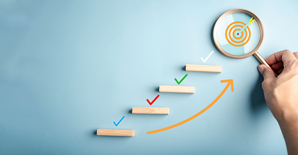 Goal setting and growth concept with checklist marks on ascending steps and a target under magnifying glass, representing productivity, planning process, milestone tracking, and achievement.